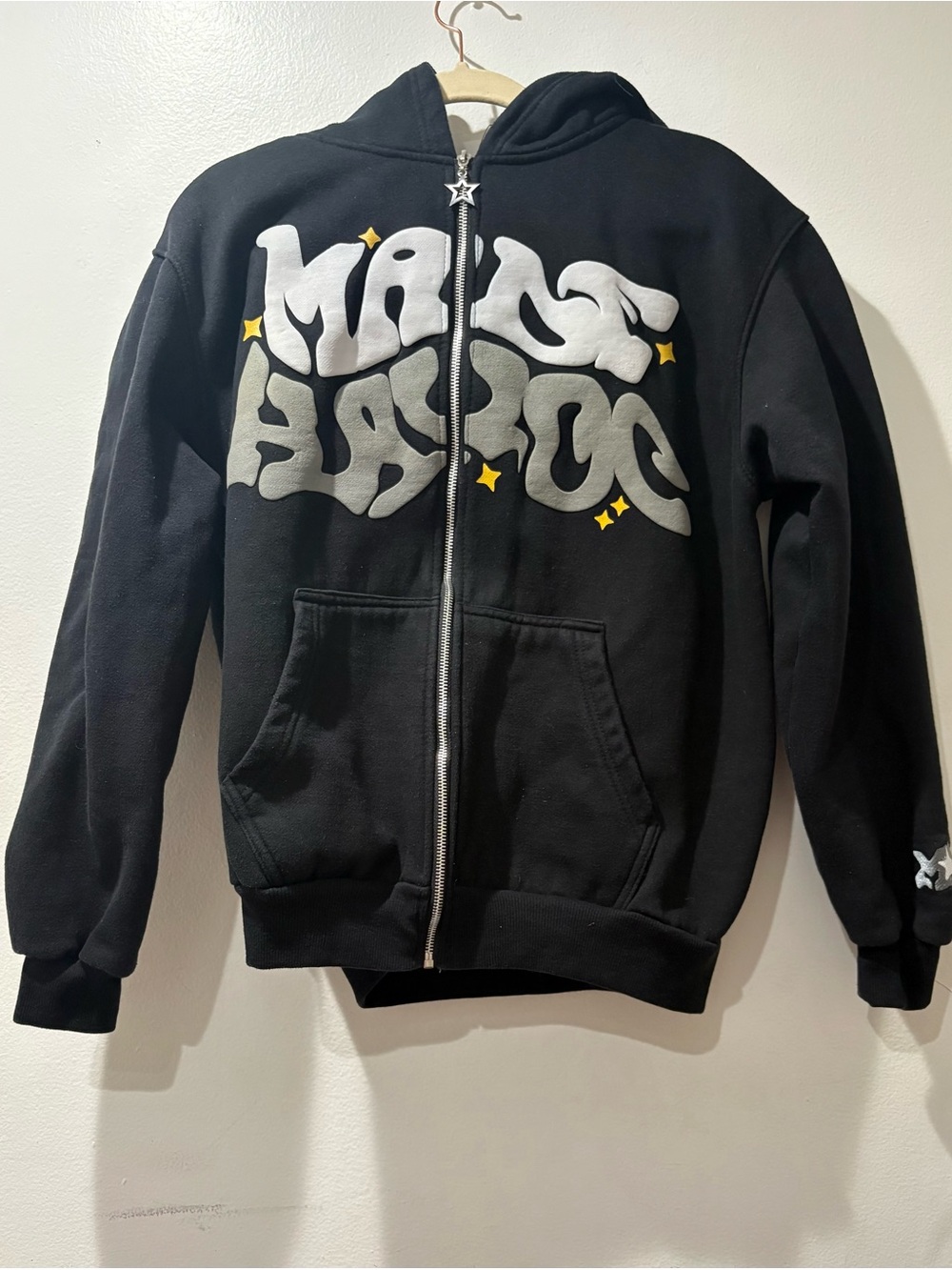 Black Zip-Up Hoodie with Silver Graphic and Yellow Star Accents
